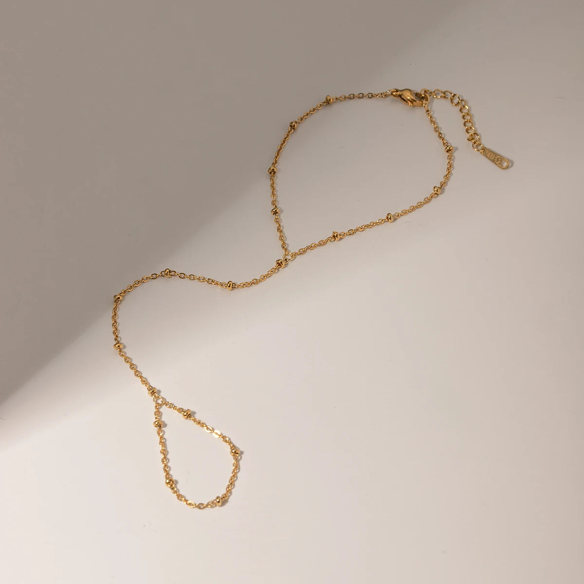 Delicate Rice Bead Handchain Bracelet, 18K gold-plated, featuring a soft shimmer and lightweight design for a refined, elegant style.