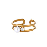 Elegant Double Band Pearl Ring with 18K gold plating, featuring a pearl and crystal accent for a modern, adjustable design.