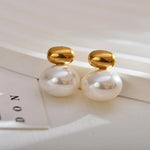 Elegant Double Pearl Gold Stud Earrings, 18K gold-plated with a large white pearl and sleek gold cap, perfect for any occasion.