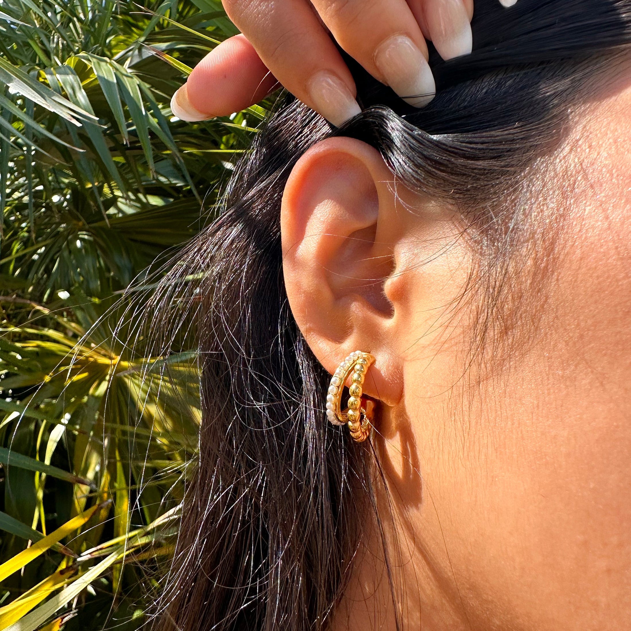 Elegant double stacked pearl hoop earrings, 18k gold-plated stainless steel with a layered design, perfect for adding timeless charm to any outfit.
