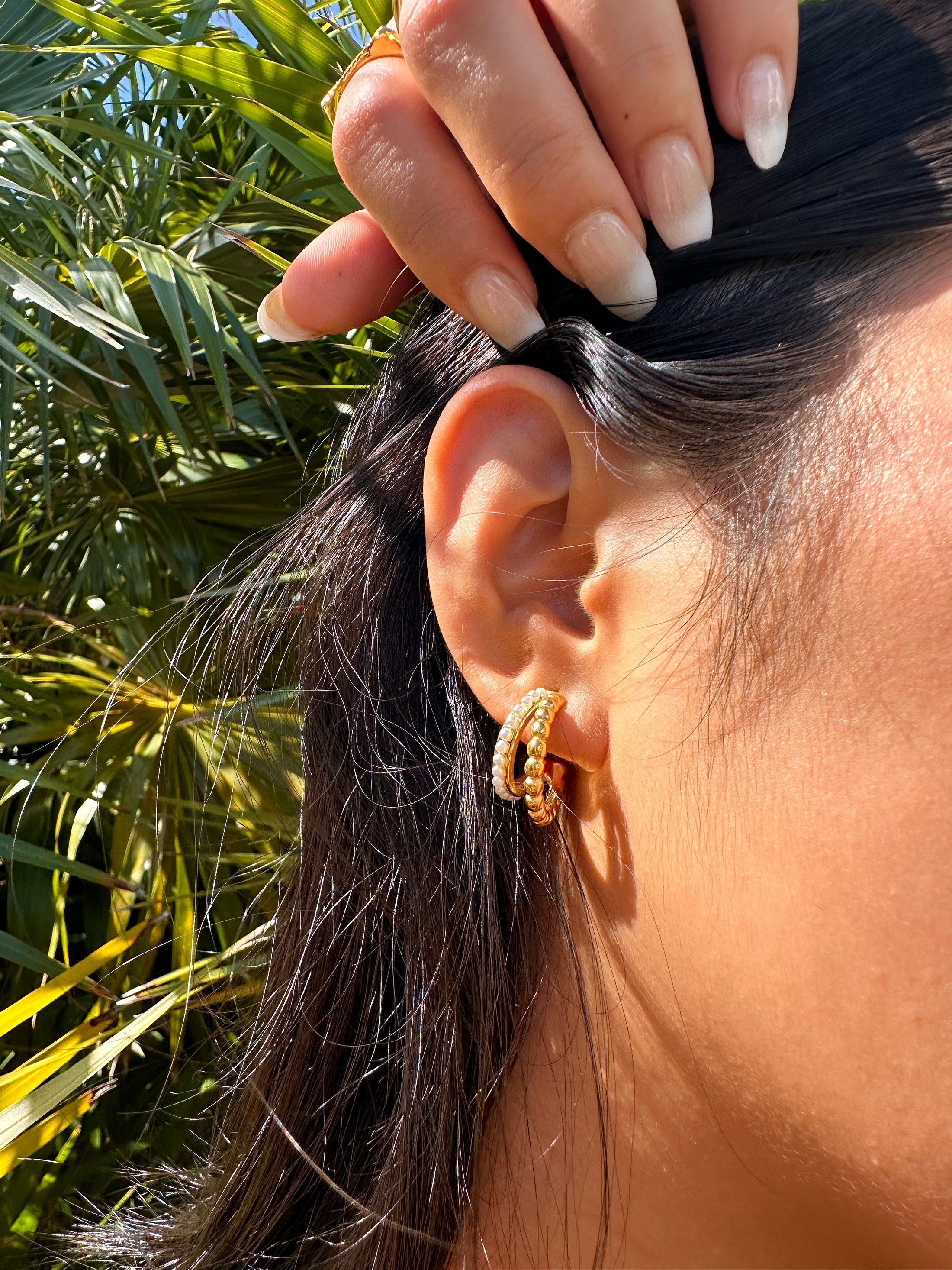 Elegant double stacked pearl hoop earrings, 18k gold-plated stainless steel with a layered design, perfect for adding timeless charm to any outfit.