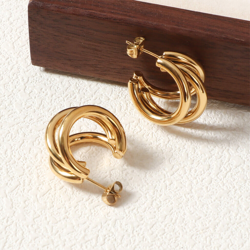 Elegant Triple Hoop Gold Earrings, 18K gold-plated with a refined layered design, ideal for both casual and formal occasions.