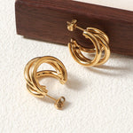 Elegant Triple Hoop Gold Earrings, 18K gold-plated with a refined layered design, ideal for both casual and formal occasions.