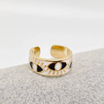 White enamel evil eye ring with gold and blue design, adjustable and gold-plated for everyday wear and symbolic protection

