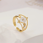 Evil eye CZ enamel ring with gold-plated stainless steel, featuring white enamel and bold design, adjustable and retro-inspired.