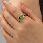 Deep blue enamel evil eye ring with gold stainless steel band, combining modern style with meaningful symbolism