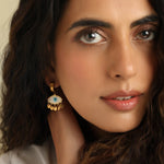Gold stainless steel evil eye drop earrings with shell charm and blue enamel for everyday boho style and protection.