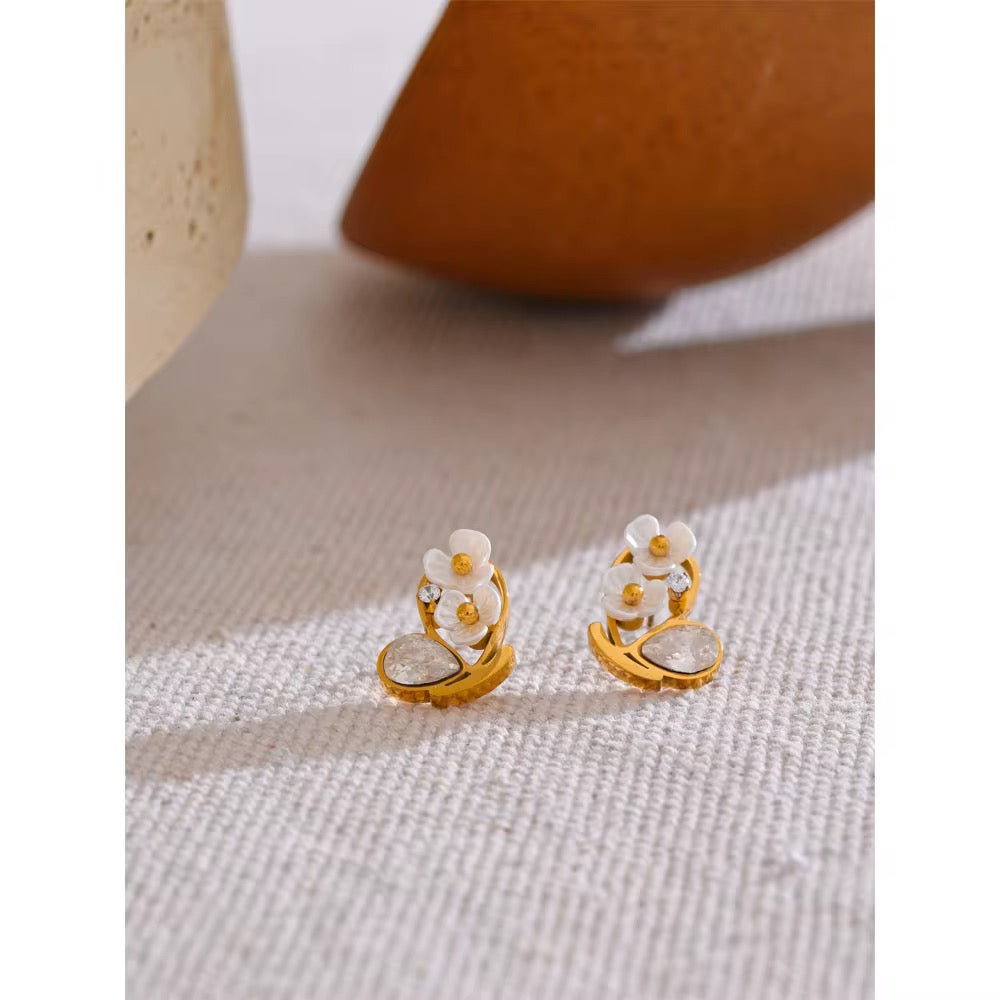 Gold-plated floral stud earrings featuring white cherry blossom petals and crystal accents