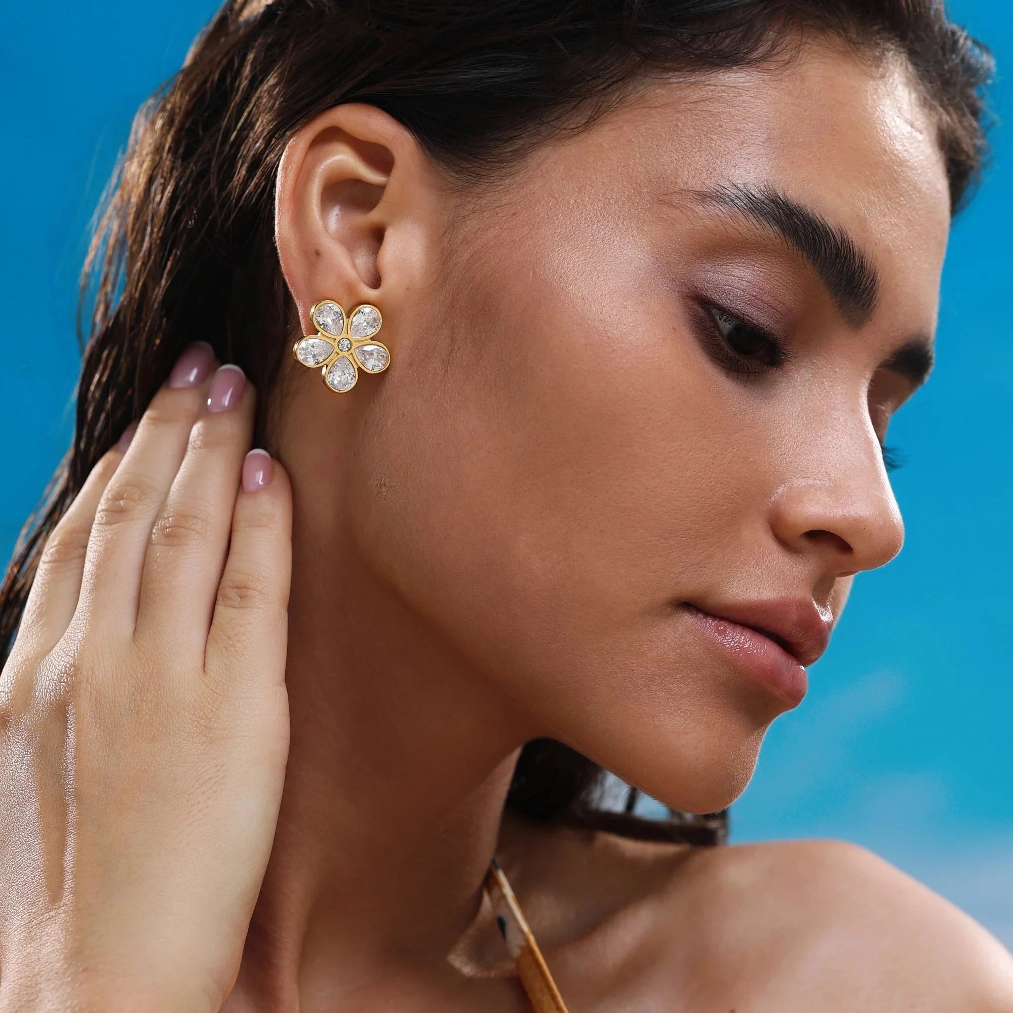 Elegant floral stud earrings with diamond-cut crystal design and 18k gold plating for a refined, feminine touch
