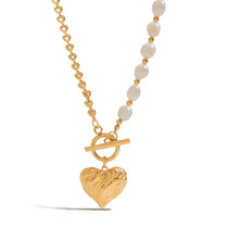 Freshwater pearl heart pendant necklace with gold-toned chain, combining elegance and charm for day-to-night style