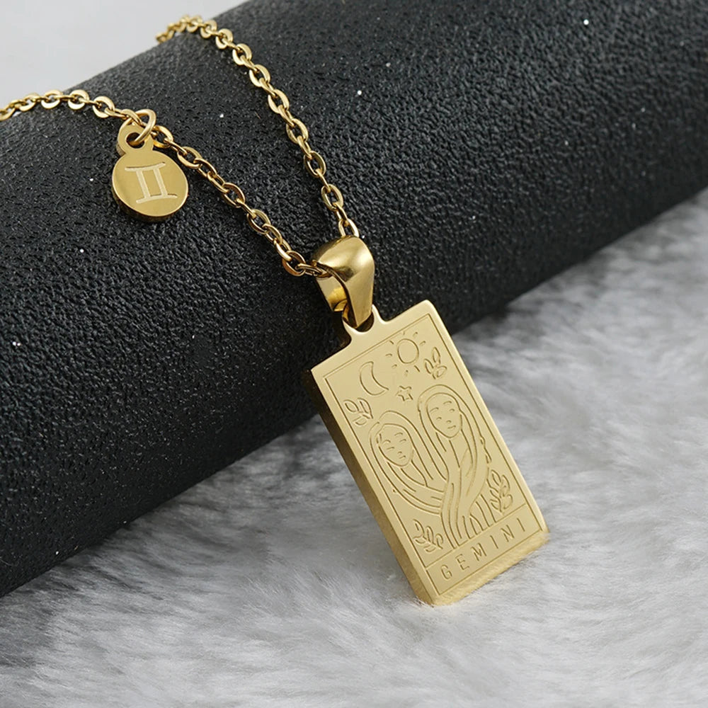 Gemini zodiac tarot necklace with engraved gold-tone pendant, 18k gold-plated stainless steel, stylish and durable astrology jewelry for daily wear.

