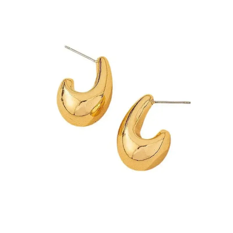 Geometric teardrop shaped statement earrings in shiny 18k gold, bold yet lightweight for stylish all-day wear