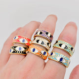 Stylish gold-plated stainless steel ring with blue enamel and eye-catching evil eye accents for daily wear

