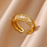 Adjustable gold ring with baguette-cut crystals and shimmering accents, ideal for adding elegance to everyday or formal outfits.

