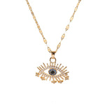 Gold Egyptian Eye Necklace with cubic zirconia evil eye charm on delicate chain, symbolizing protection and wisdom.