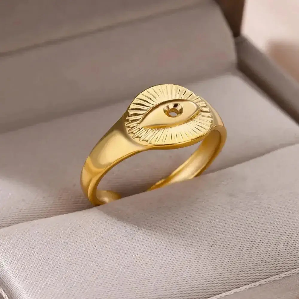 Gold Evil Eye Protection Ring crafted from stainless steel with 18k gold plating. Adjustable design with an evil eye engraving to ward off negativity.