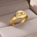 Gold Evil Eye Protection Ring crafted from stainless steel with 18k gold plating. Adjustable design with an evil eye engraving to ward off negativity.
