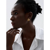 Modern gold flower stud earrings with open petal design, lightweight and perfect for daily wear.