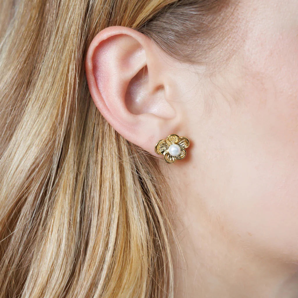 Elegant gold-plated pearl flower earrings with oversized floral design for a bold, stylish look