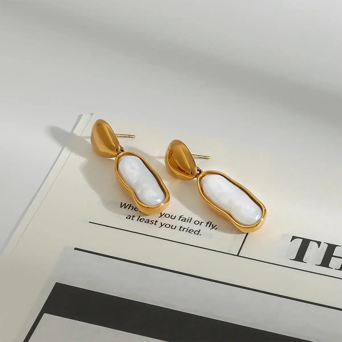 Elegant Gold-Plated Pearls Drop Earrings featuring contemporary design with irregular pearls, perfect for any occasion.