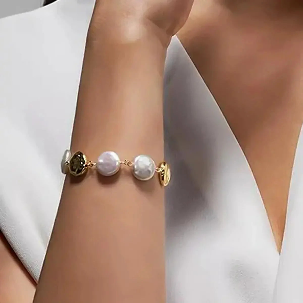 Timeless Gold-Plated Circle Imitation Pearl Bracelet featuring a smooth loop of ivory pearls, perfect for elegant and modern looks.