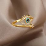 Gold-plated evil eye ring featuring blue stone, symbolic of protection, made with zirconia, turquoise, and onyx for daily wear.