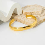 Stylish Gold-Plated Lady's Evil Eye Cuff Bracelet with a unique eye design, symbolizing protection and adding a bold touch to any look.