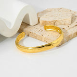 Stylish Gold-Plated Lady's Evil Eye Cuff Bracelet with a unique eye design, symbolizing protection and adding a bold touch to any look.