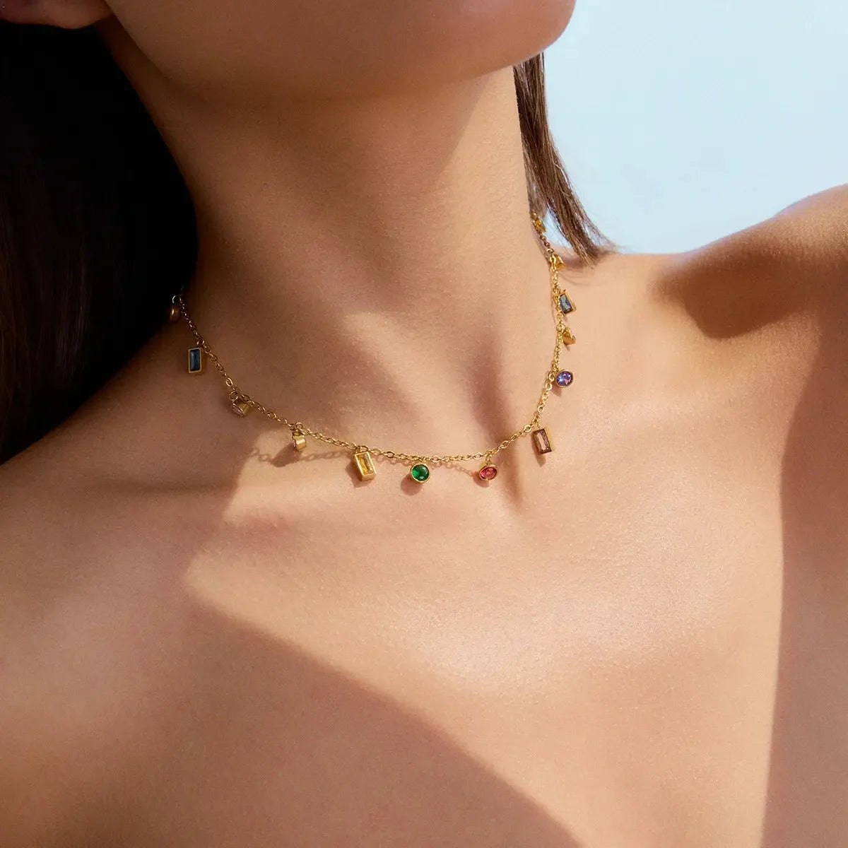 Stylish Gold-Plated Rainbow Charm Necklace Bracelet with colorful gemstones, adding a cheerful and vibrant touch to any look.

