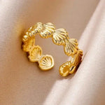 18k gold seashell ring with adjustable fit, capturing coastal vibes and timeless beach-inspired beauty