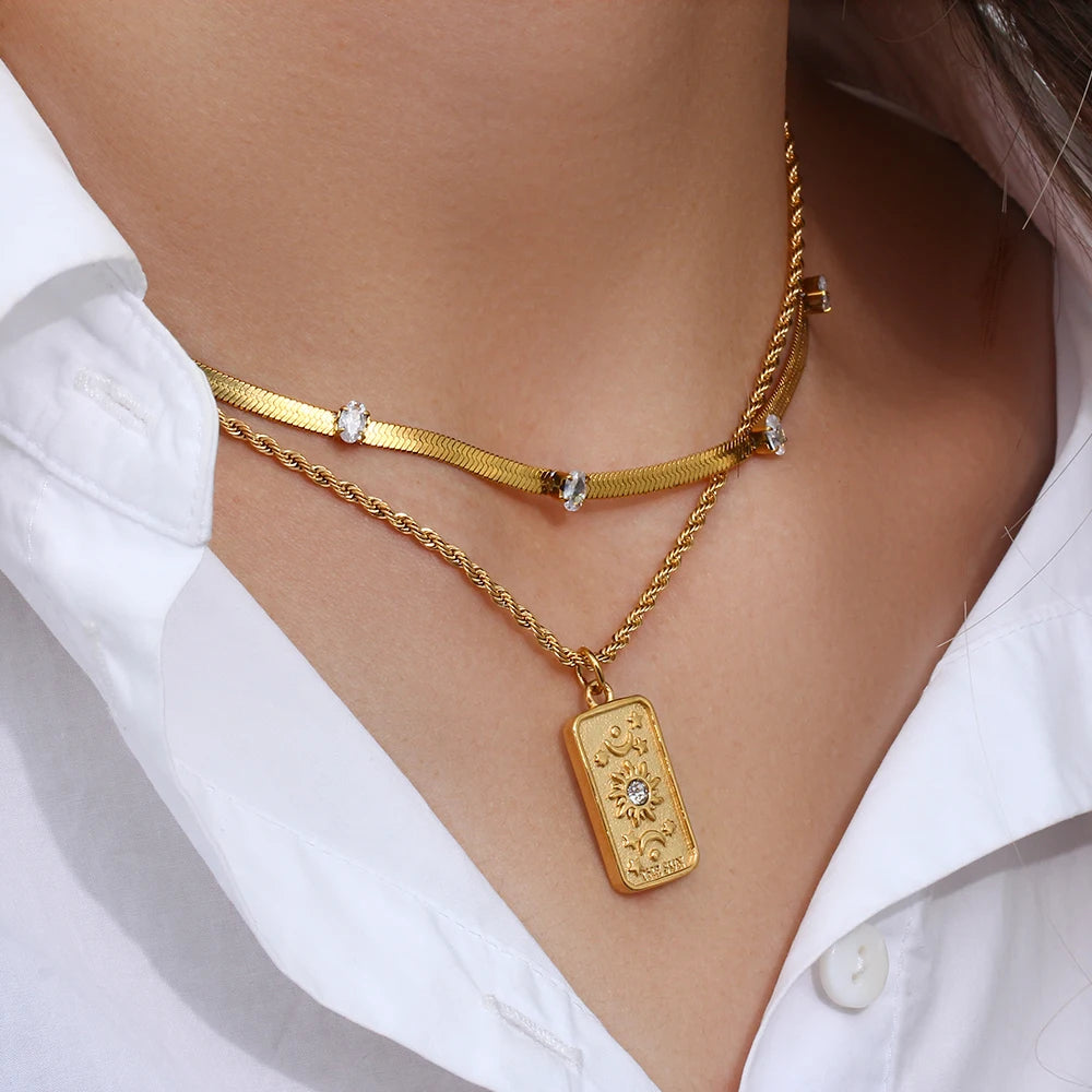 Stylish gold Sun Tarot Card Pendant featuring cubic zirconia details, perfect for adding a magical touch to any outfit.