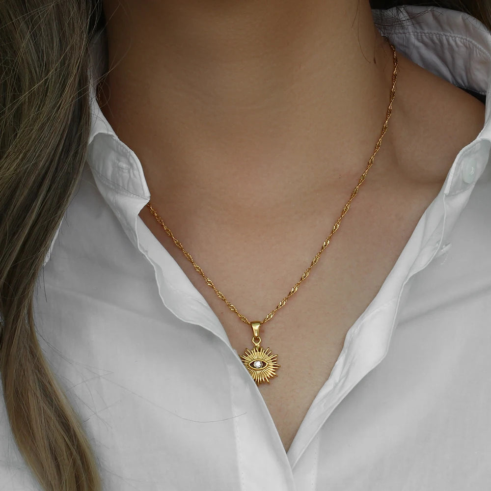 Stylish Gold Sunray Evil Eye Necklace with cubic zirconia, offering protection and clarity, perfect for daily wear or layering.