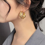Stylish Gold Triple Hoop Earrings, 18K gold-plated with a modern layered design, perfect for casual or formal occasions.