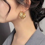 Stylish Gold Triple Hoop Earrings, 18K gold-plated with a modern layered design, perfect for casual or formal occasions.