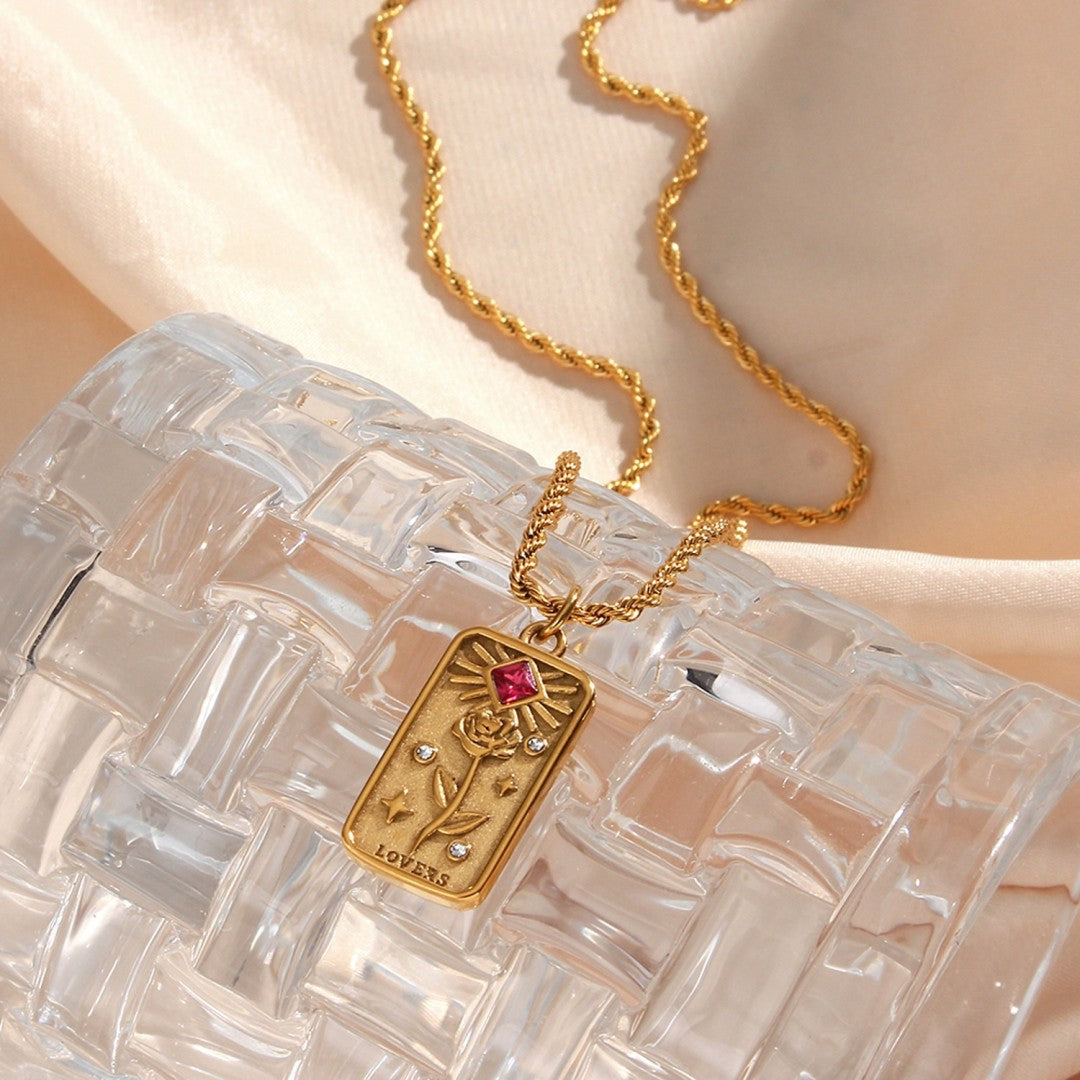 Gold-plated lovers tarot card pendant necklace with intricate rose and star design, representing love, harmony, and positive energy.