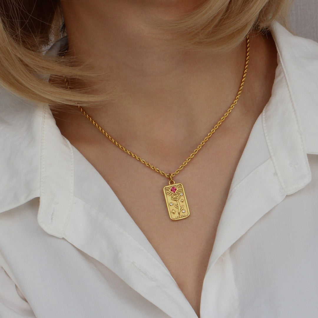 Gold lovers tarot card necklace with rose and star details, accented with cubic zirconia, symbolizing love and meaningful connections.