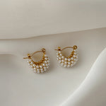 Stylish Mini Glow U Pearl Earrings, featuring gold-plated hoops and pearls, designed for a minimalist yet luxurious feel.