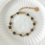 Minimalist evil eye bracelet crafted from stainless steel with colorful enamel accents for protection