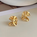 Modern gold flower stud earrings with a crumpled petal design, crafted in stainless steel with 18k gold plating for daily elegance.