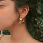 Modern Triple Hoop Gold Earrings, 18K gold-plated with a stylish layered design, perfect for adding elegance to any outfit.