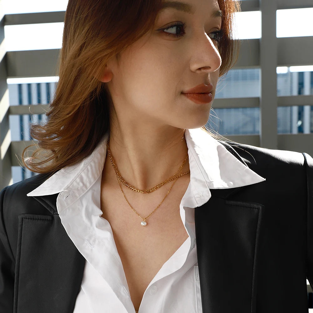 Elegant Natural Pearl Gold Triple Chain Necklace with three layered chains and a pearl drop, ideal for adding a touch of sophistication to any look.