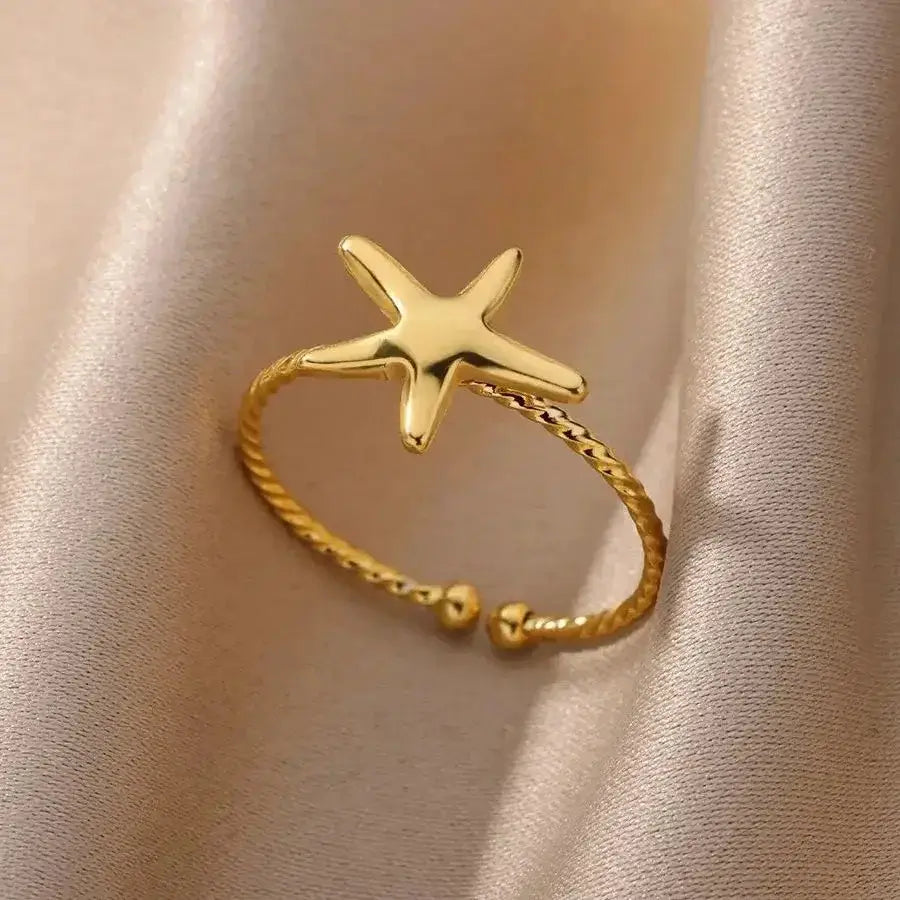 Adjustable gold starfish ring featuring a sea-inspired design, perfect for ocean lovers seeking a coastal charm accessory.