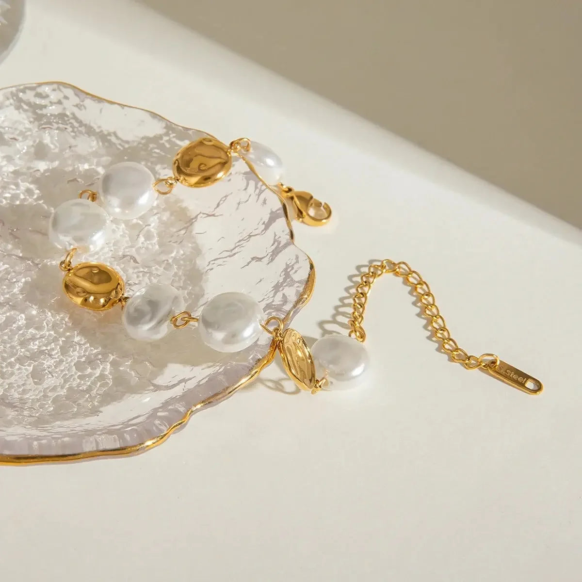 Elegant Pearl Circle Bracelet with 18K gold-plated finish, featuring a smooth loop of ivory pearls for a chic, modern accessory.