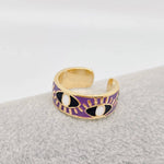 Adjustable purple enamel ring with gold and blue evil eye design, gold-plated stainless steel for style and daily protection