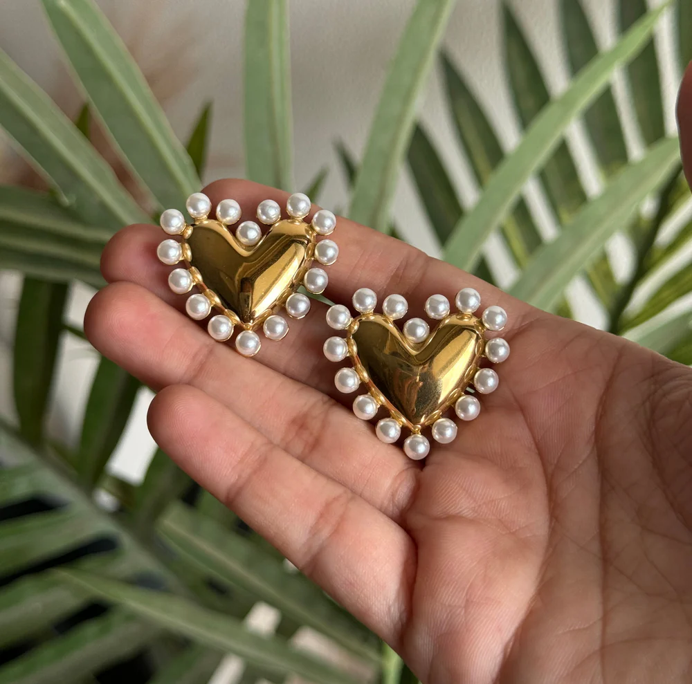 Romantic heart-shaped earrings with pearl detail and gold finish, waterproof and hypoallergenic, great for gifting