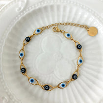 Adjustable Sea of Evil Eyes bracelet with 18K gold plating, designed for protection and good luck, perfect for daily wear and gifting.