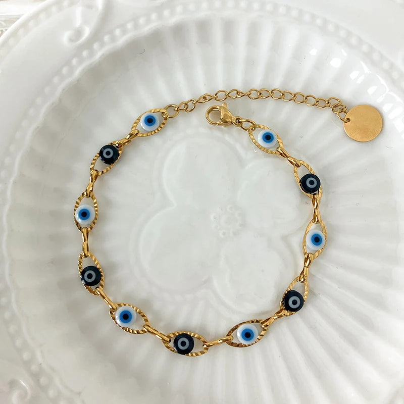 Adjustable Sea of Evil Eyes bracelet with 18K gold plating, designed for protection and good luck, perfect for daily wear and gifting.