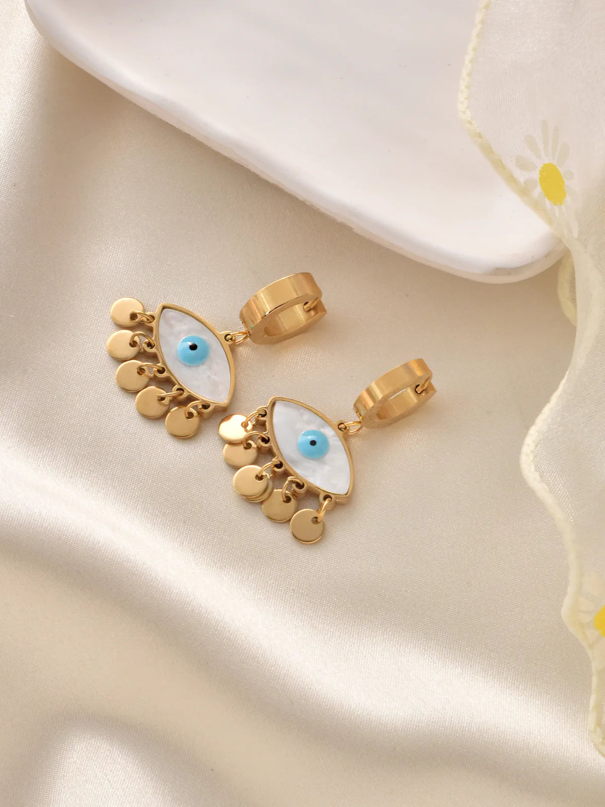Gold-plated shell evil eye drop earrings with blue charm, lightweight and stylish for everyday wear and protection.