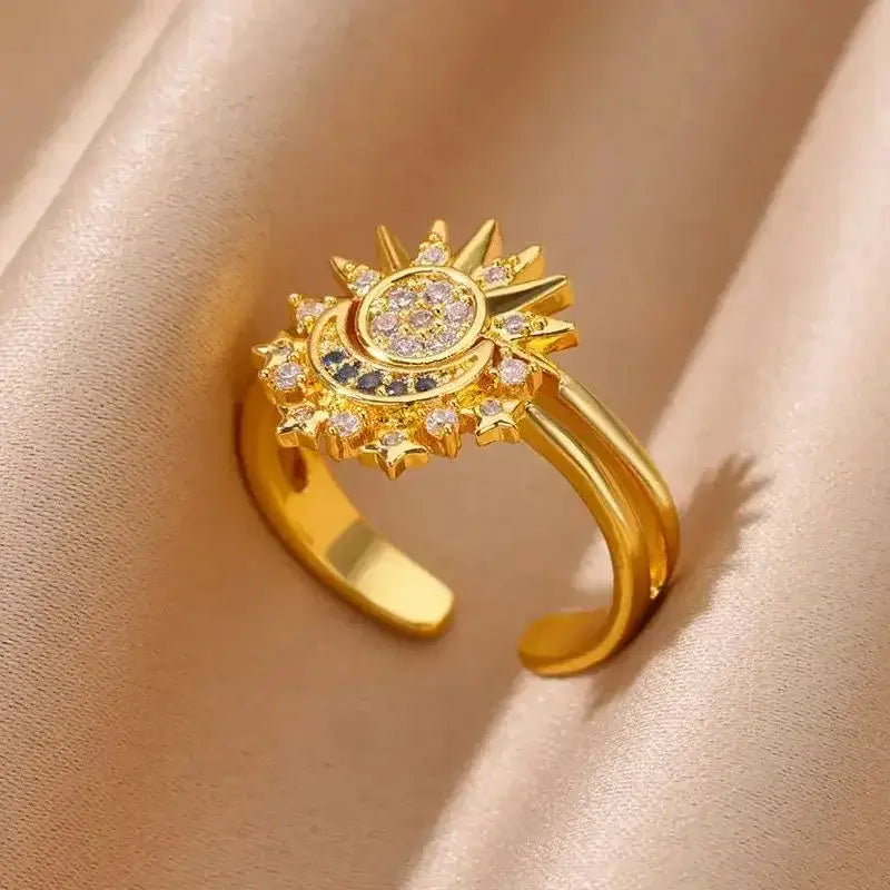 Adjustable 18k gold plated ring with cosmic sun and moon design, ideal for stylish celestial jewelry lovers.