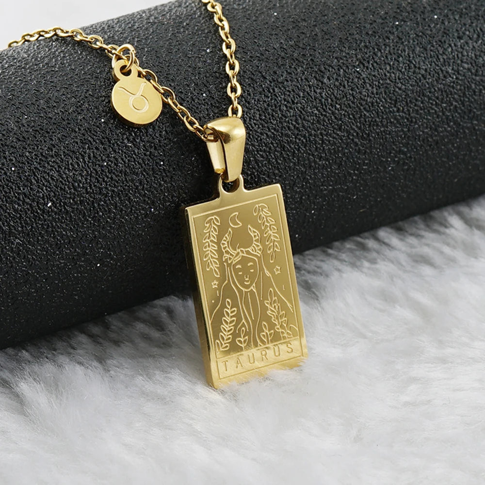 Taurus zodiac tarot necklace with engraved gold-tone pendant, 18k gold-plated stainless steel, stylish and durable astrology jewelry for daily wear.

